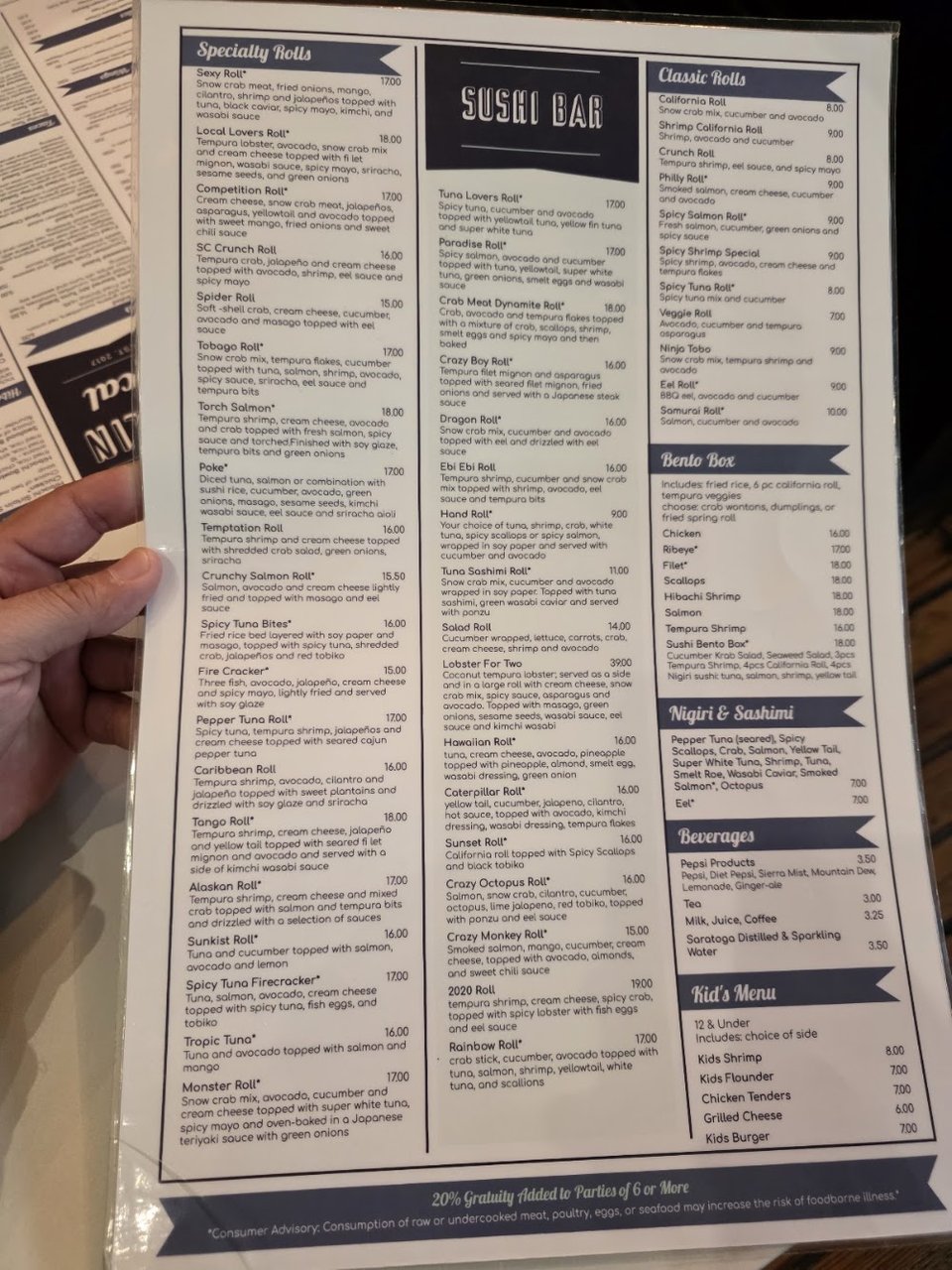 Printed menu with lunch, food, and drinks sections.
